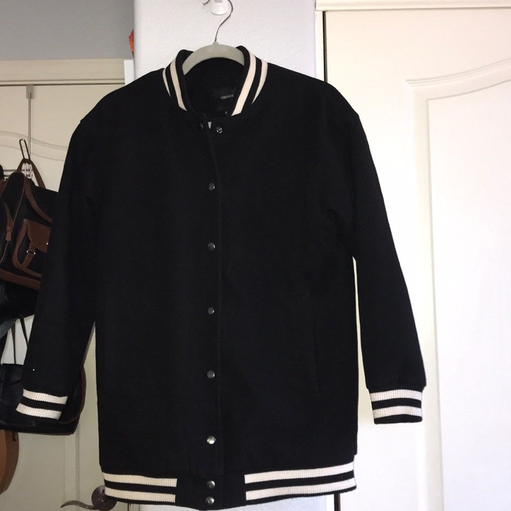 Thick black and white varsity style bomber jacket
